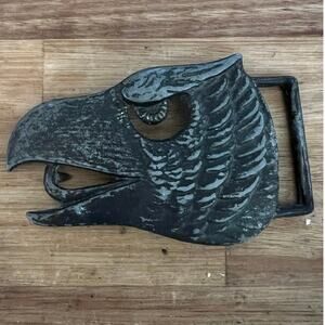 American Eagle head belt buckle stamped Accurate 5215. 
Unknown metal.